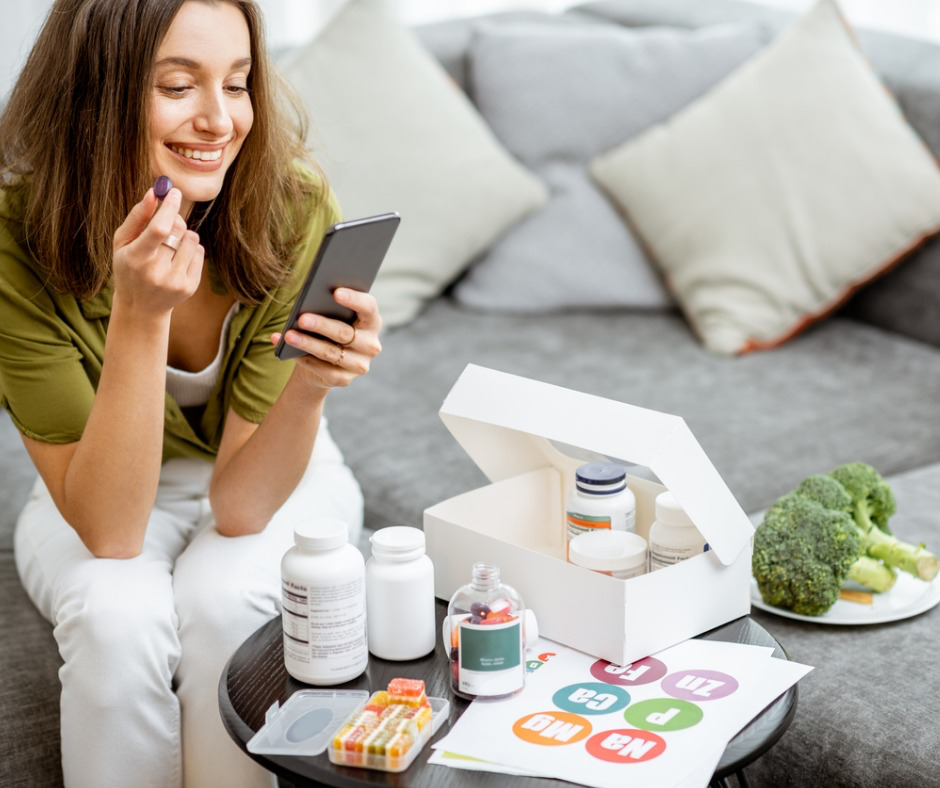 womantakingvitaminsornutritionalsupplementspictureid1193488910