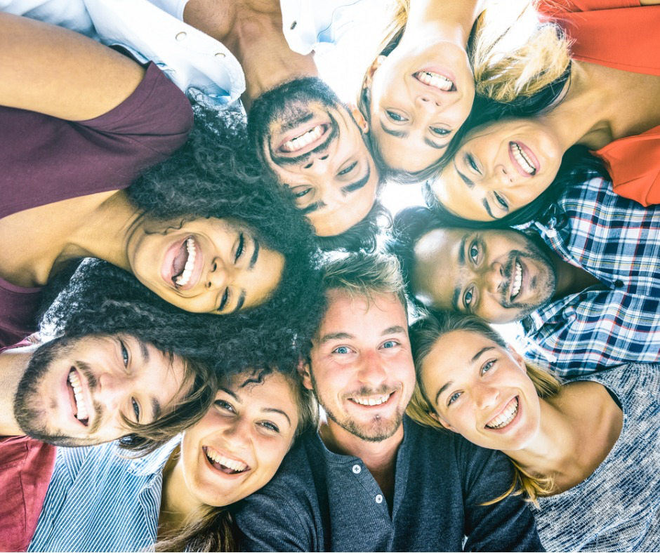 multiracialbestfriendsmillennialstakingselfieoutdoorswithback